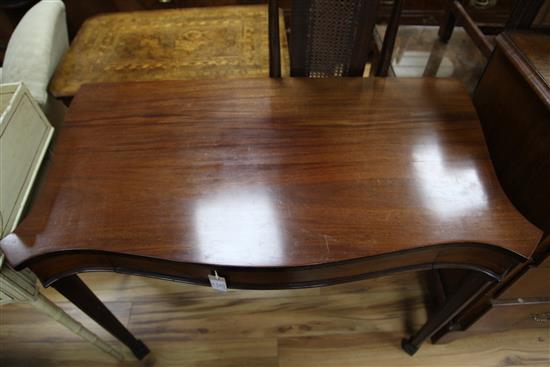 A George III mahogany serpentine shape side table, W.3ft 8in.